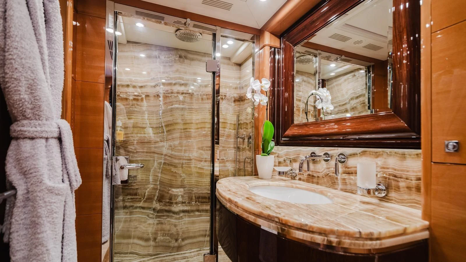 a bathroom with a large mirror aboard GROOVER Yacht for Sale