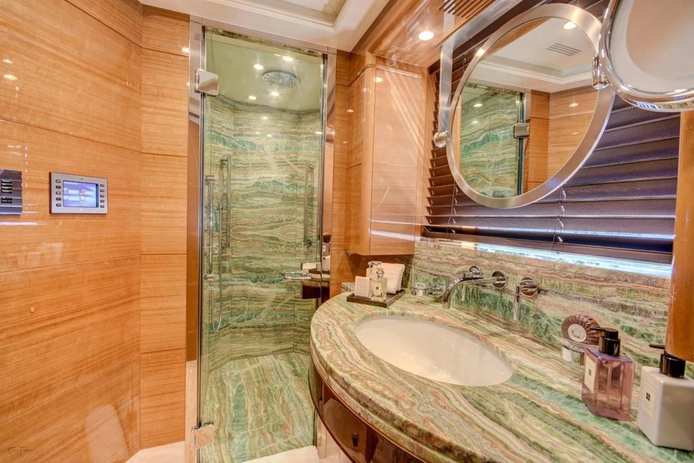 a bathroom with a large mirror aboard GROOVER Yacht for Sale