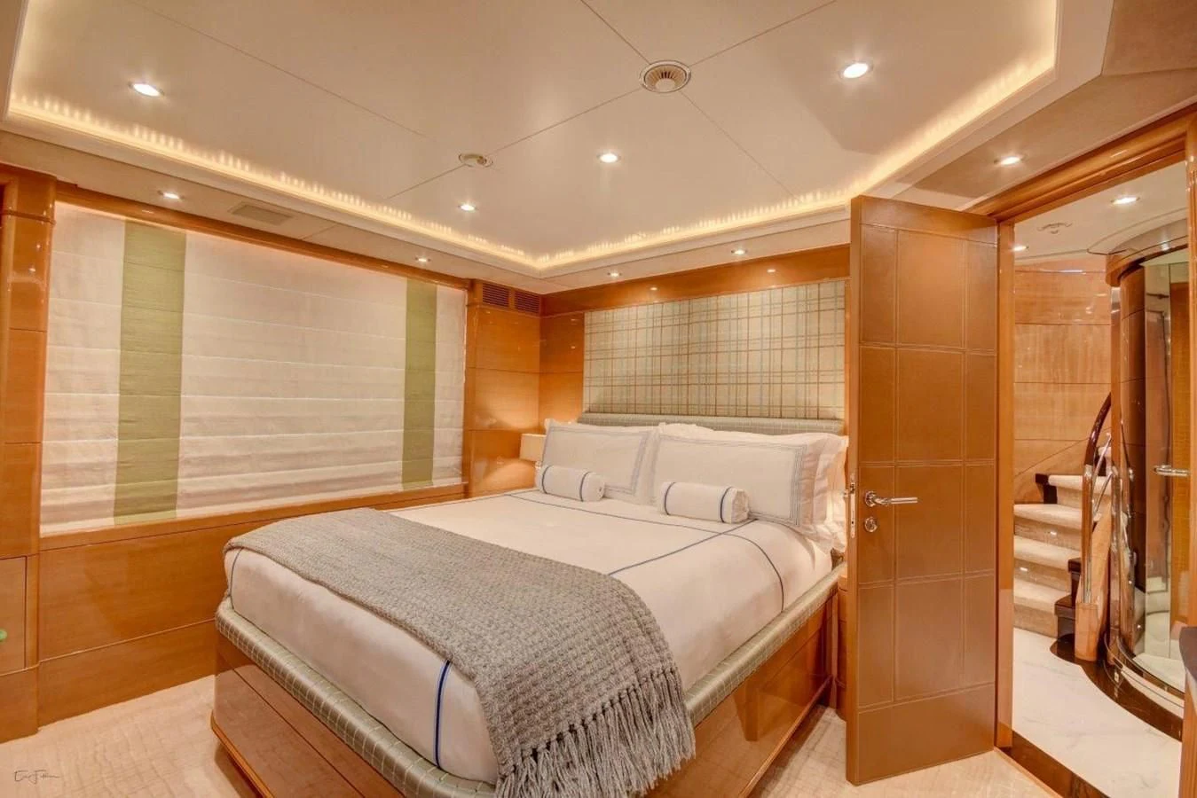 a room with a bed and a mirror aboard GROOVER Yacht for Sale