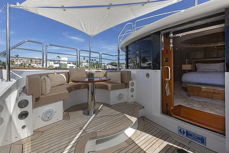 a boat with a bed and a table aboard GROOVER Yacht for Sale