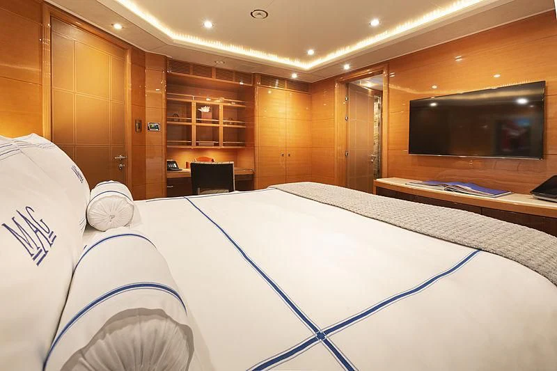 a room with a bed and a television aboard GROOVER Yacht for Sale