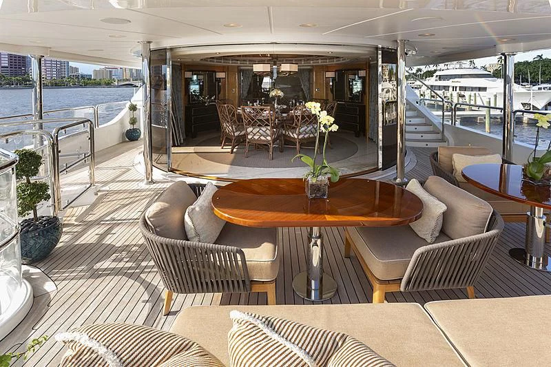 a room with a table chairs and a large window aboard GROOVER Yacht for Sale