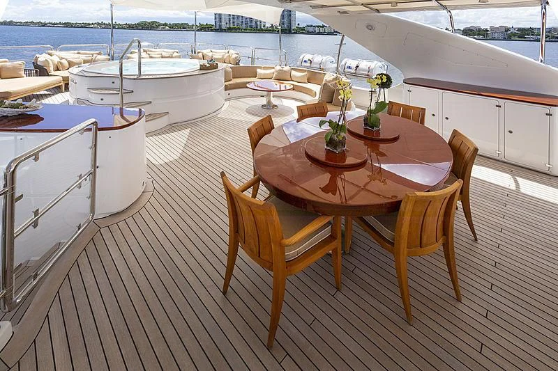 a table and chairs on a deck aboard GROOVER Yacht for Sale