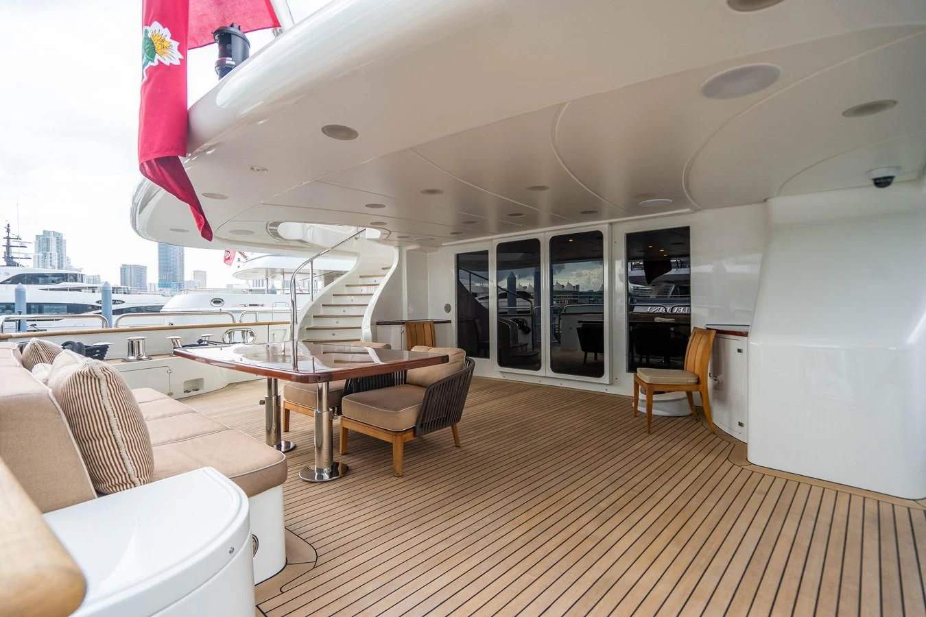 a room with a table chairs and a large window aboard GROOVER Yacht for Sale