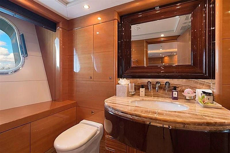 a bathroom with a large mirror aboard GROOVER Yacht for Sale