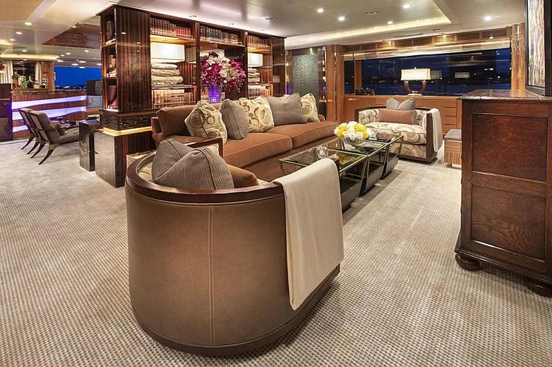 a living room with a couch and a coffee table aboard GROOVER Yacht for Sale
