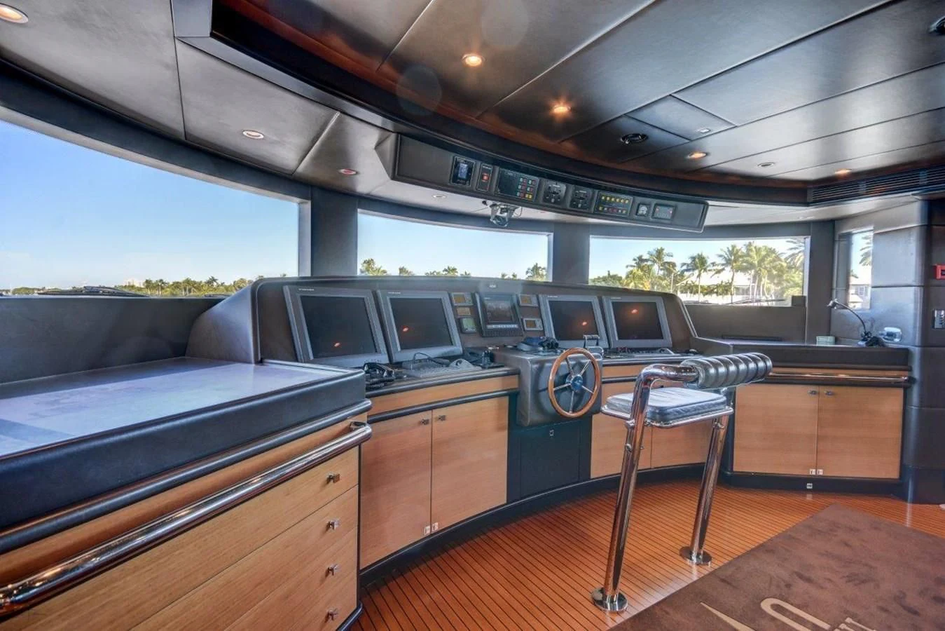 a kitchen with a table and chairs aboard GROOVER Yacht for Sale