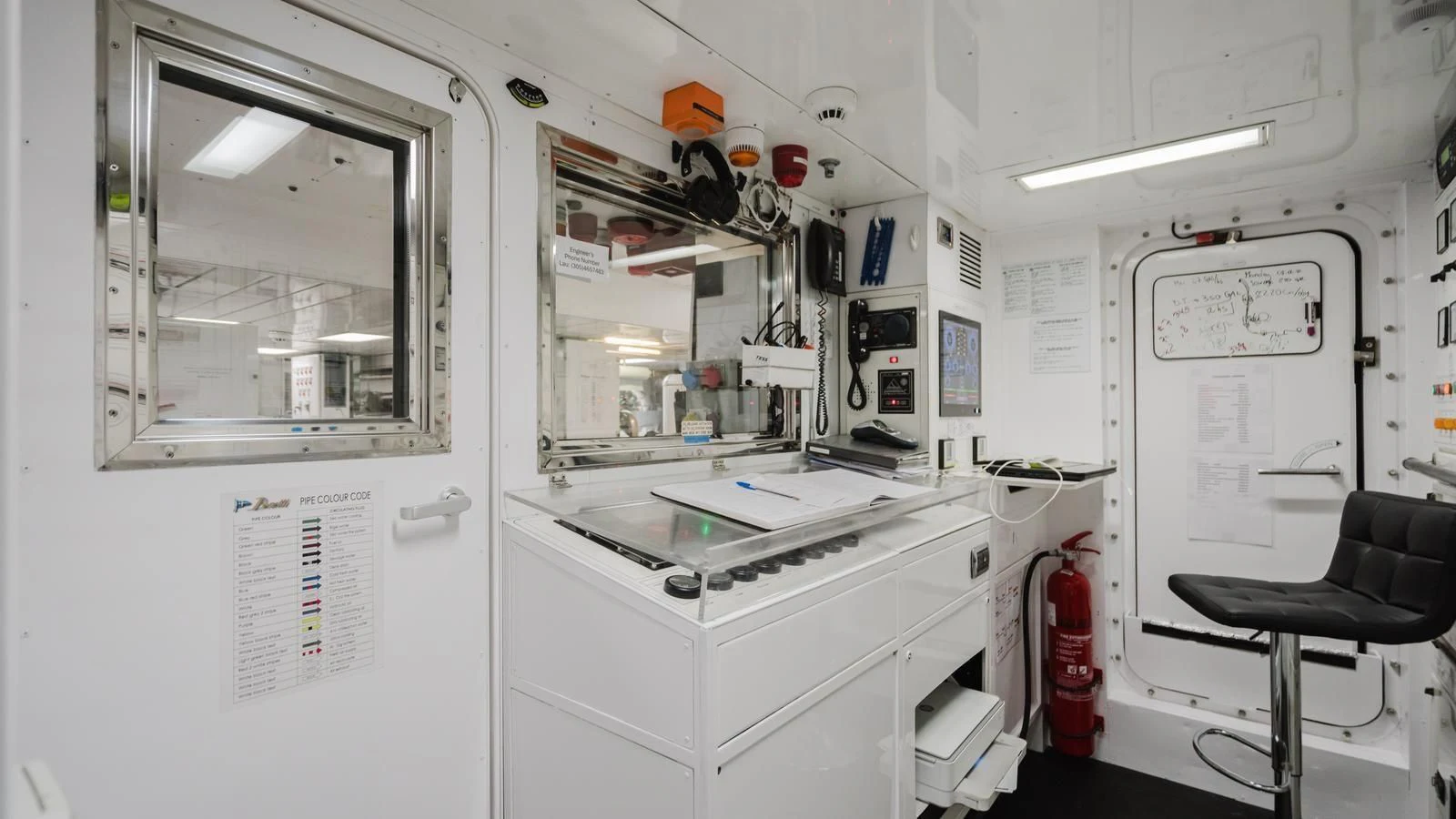 a room with a chair and a desk aboard GROOVER Yacht for Sale