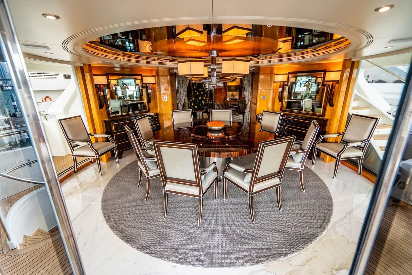 a room with a table chairs and a large window aboard GROOVER Yacht for Sale