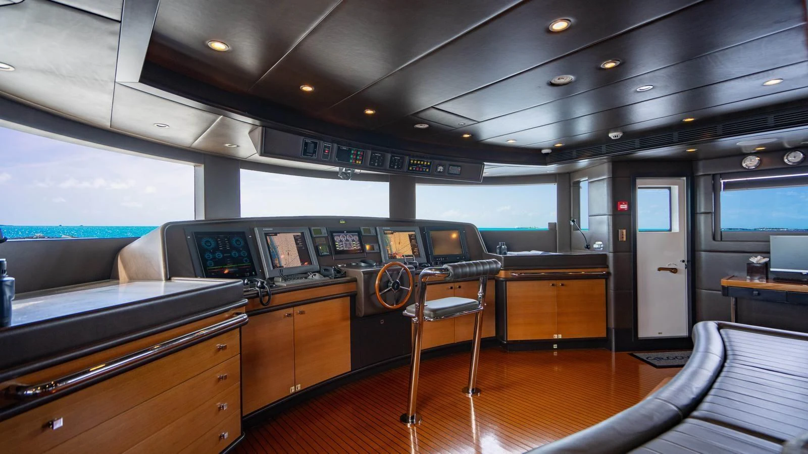 a room with a desk and chairs aboard GROOVER Yacht for Sale