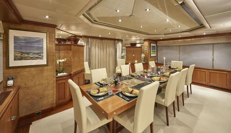 a dining room with a table and chairs aboard AZUL V Yacht for Charter