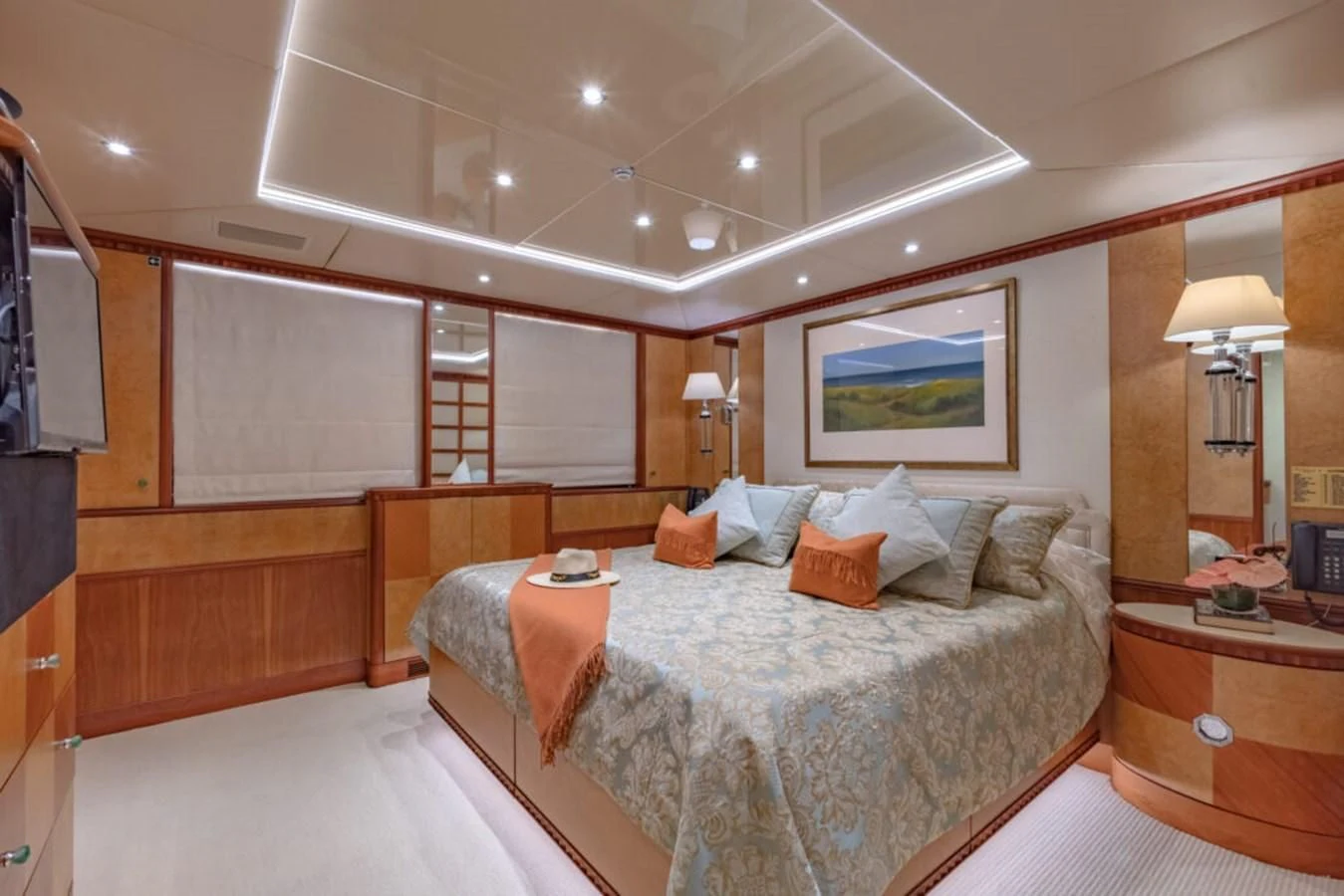 a bedroom with a bed and a desk aboard AZUL V Yacht for Charter