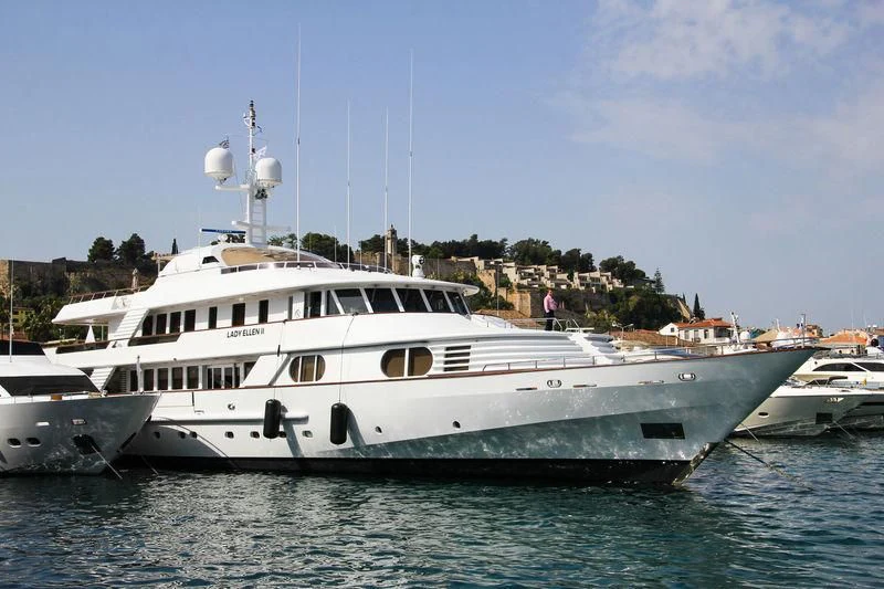 a couple of white yachts in the water aboard AZUL V Yacht for Charter