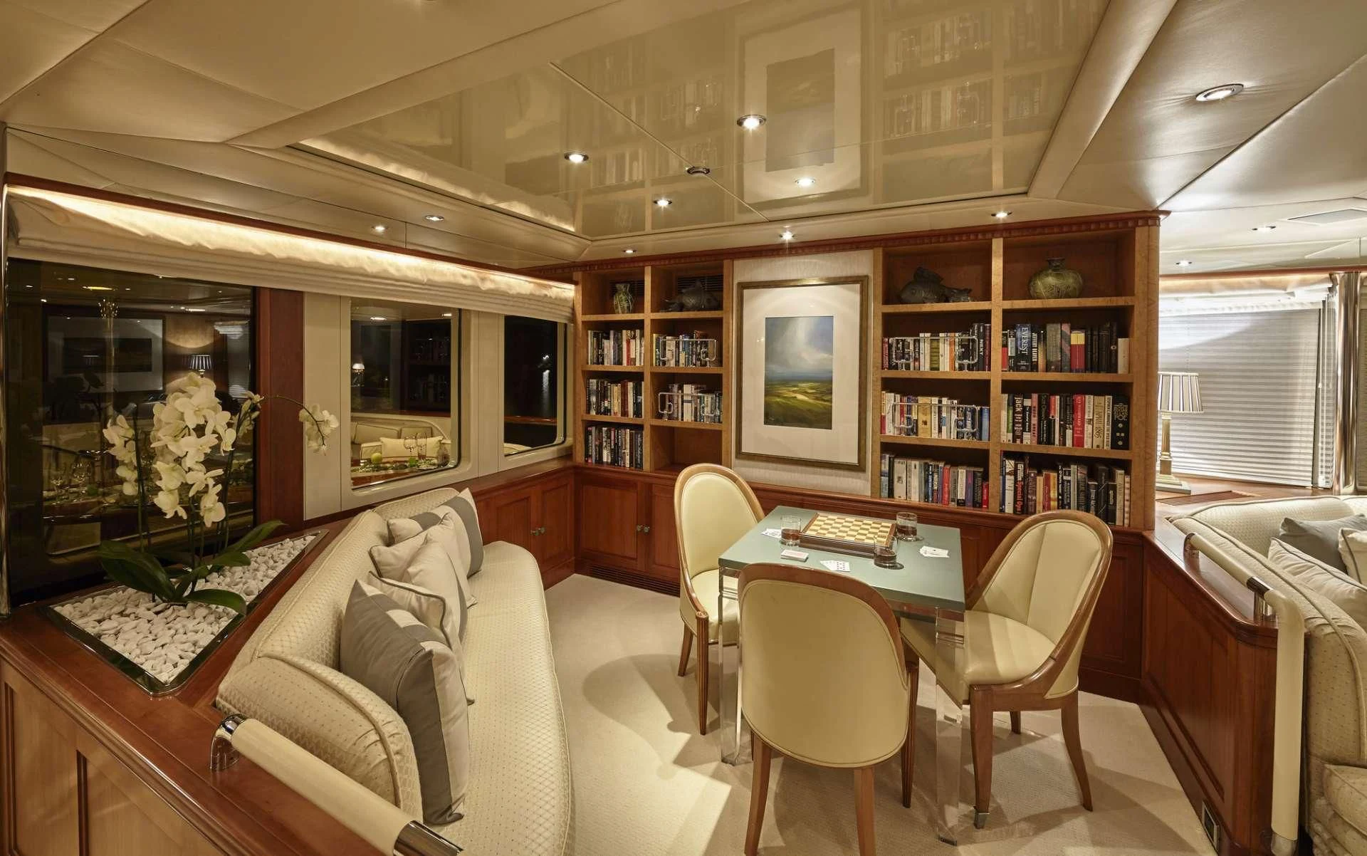 a living room with a table and chairs aboard AZUL V Yacht for Charter