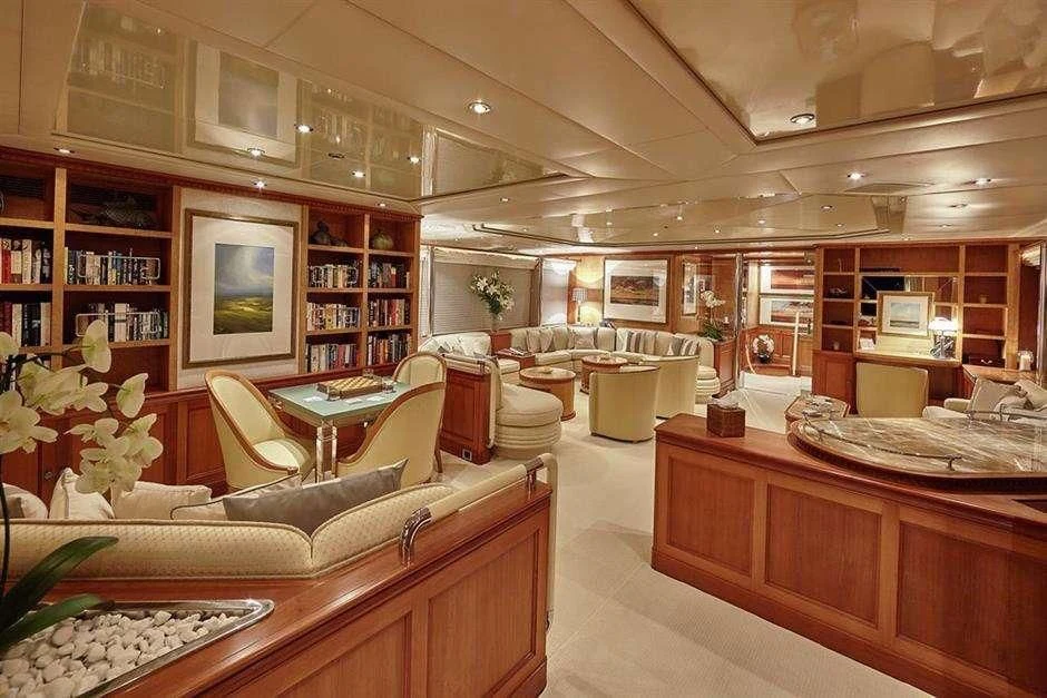 a living room with a couch and a table aboard AZUL V Yacht for Charter