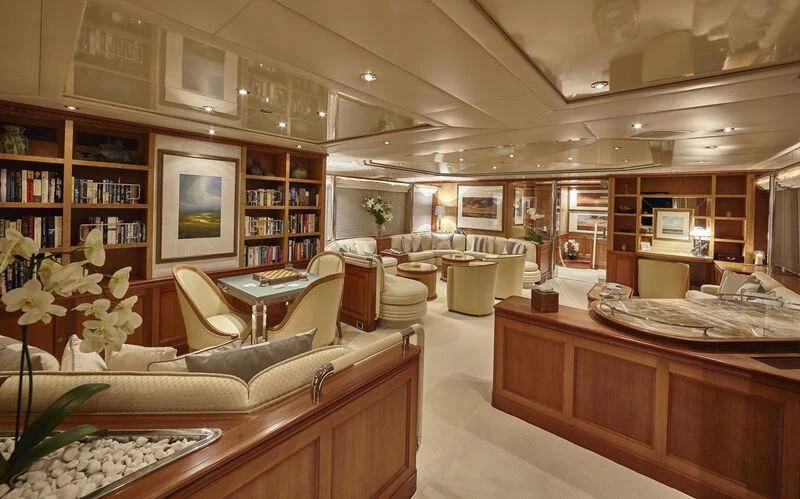 a room with a couch and a table aboard AZUL V Yacht for Charter