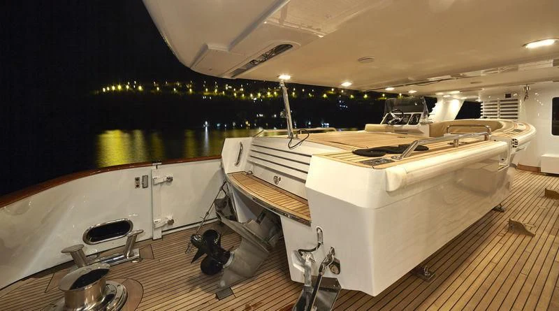a room with a large white table and chairs aboard AZUL V Yacht for Charter