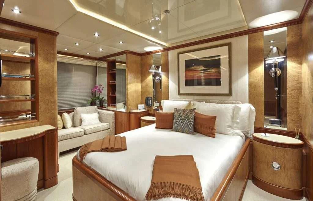 a large bed in a room aboard AZUL V Yacht for Charter