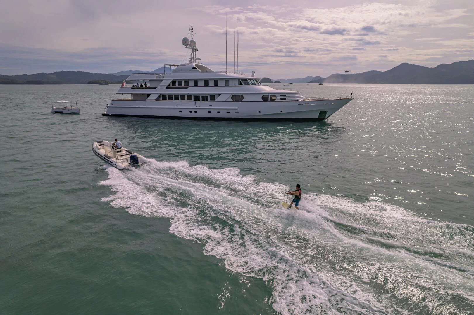a boat in the water with a person in it aboard AZUL V Yacht for Charter