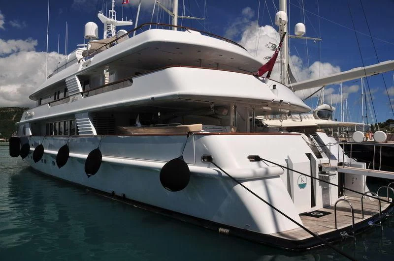 a white boat with blue water aboard AZUL V Yacht for Charter