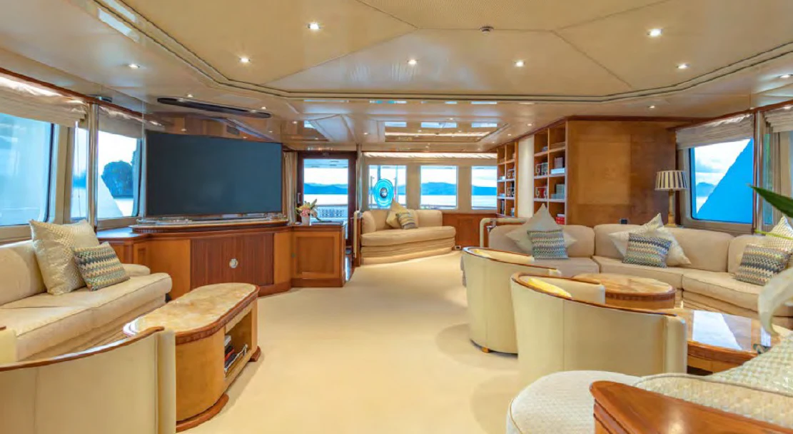 a living room with a large screen aboard AZUL V Yacht for Charter