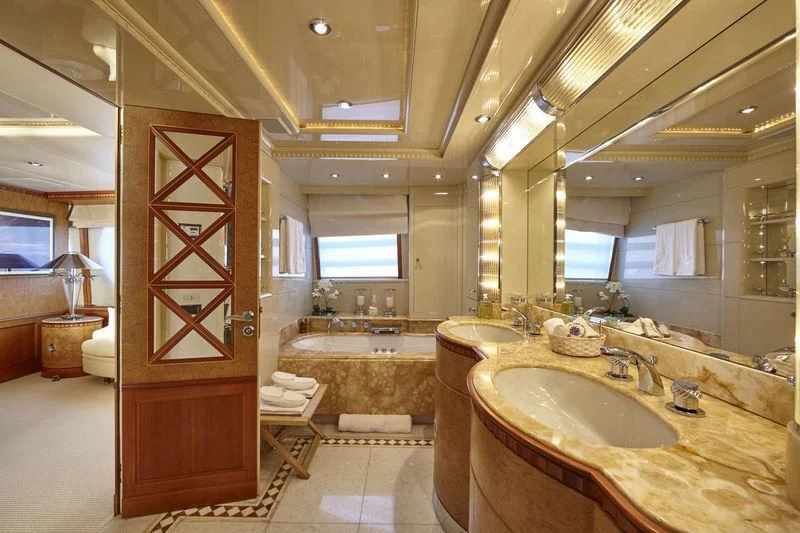 a bathroom with a large wooden door aboard AZUL V Yacht for Charter