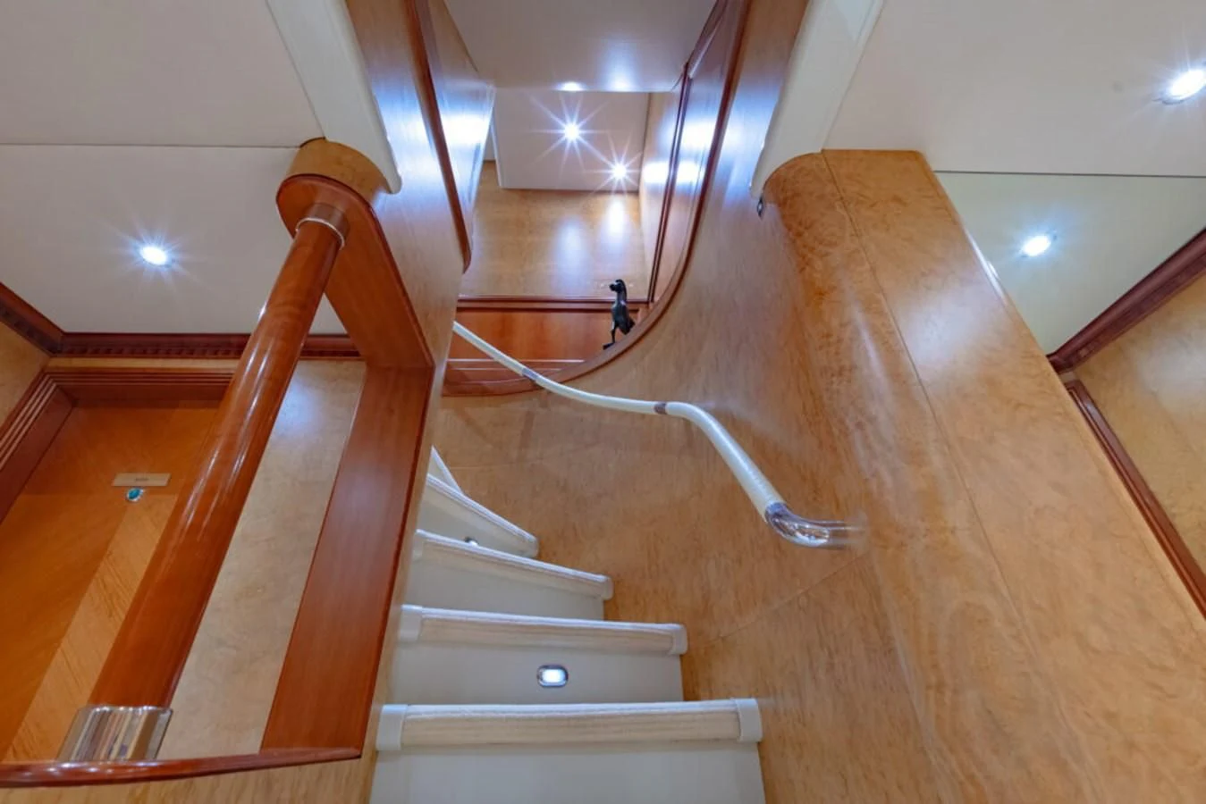 a staircase with a wood railing aboard AZUL V Yacht for Charter