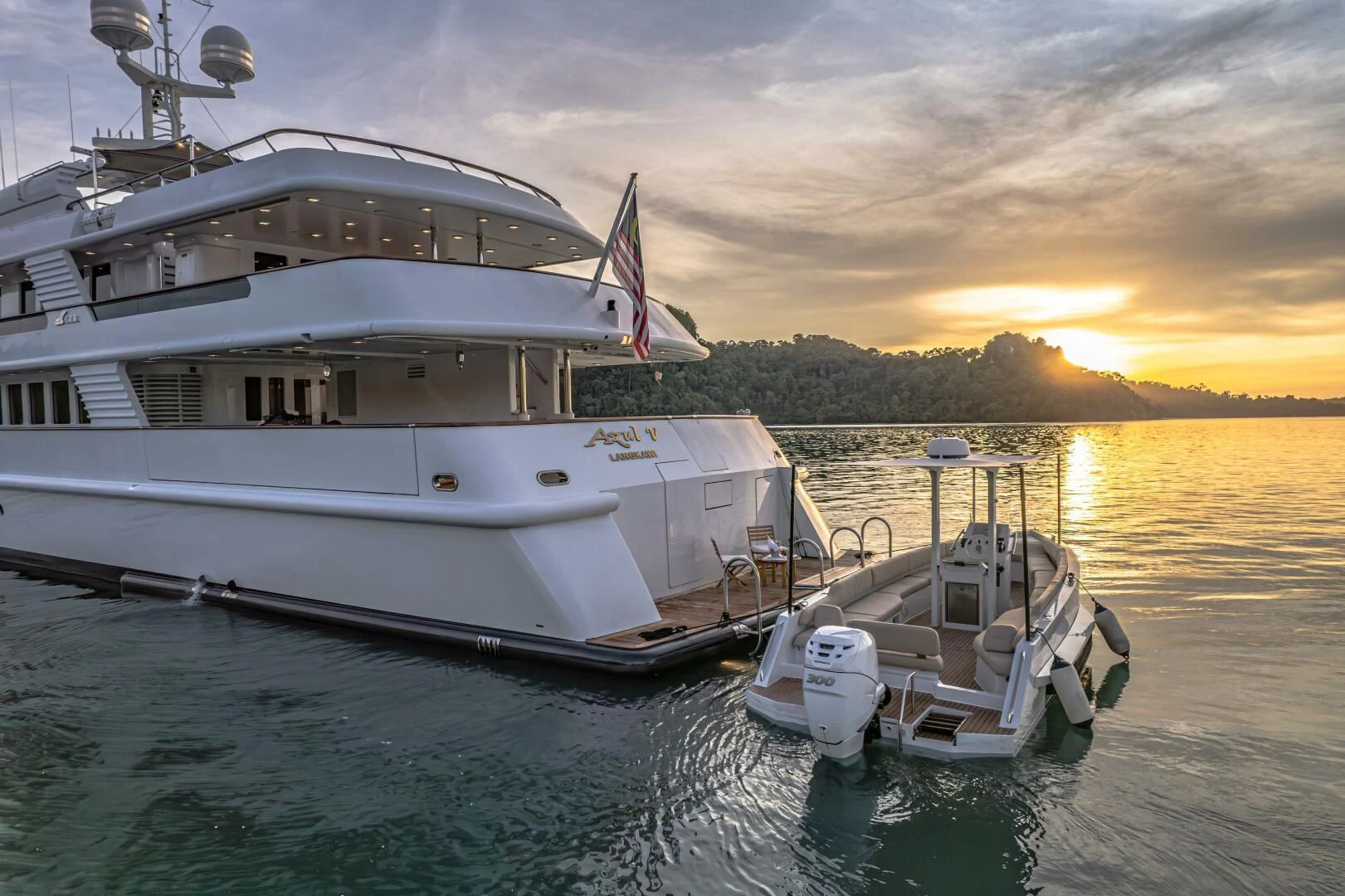 a couple of boats sit in the water aboard AZUL V Yacht for Charter