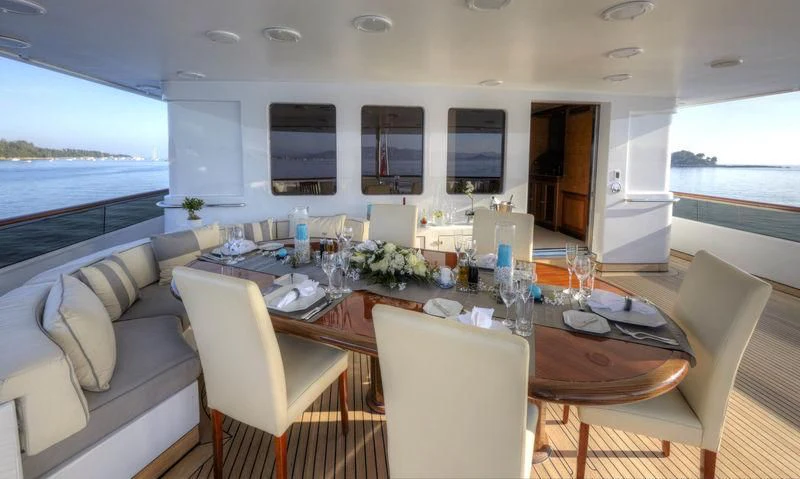 a dining table in a room aboard AZUL V Yacht for Charter