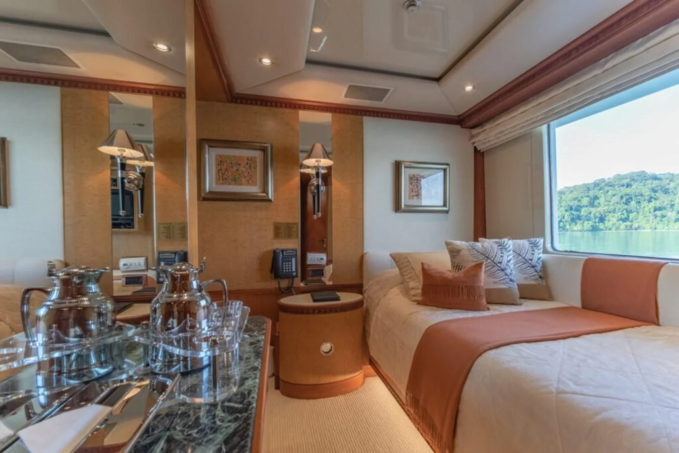 a hotel room with a glass table aboard AZUL V Yacht for Charter
