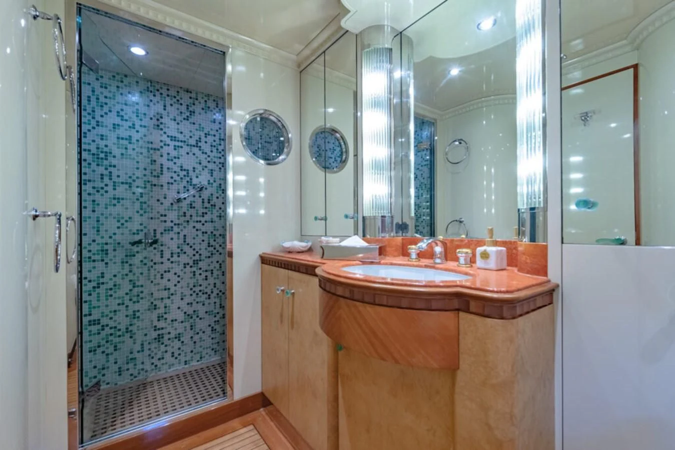 a bathroom with a sink and a shower aboard AZUL V Yacht for Charter