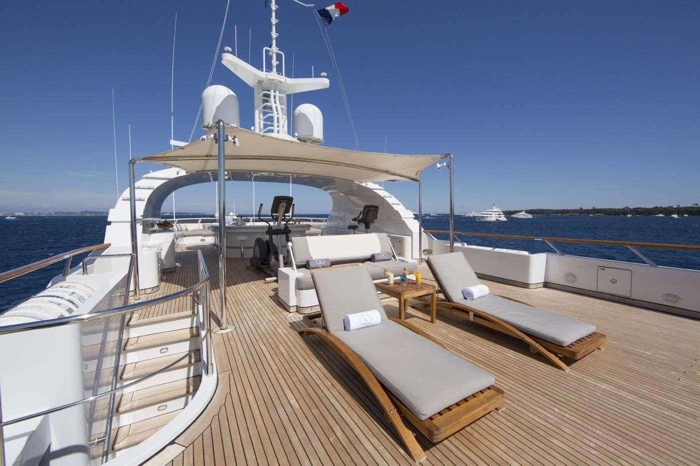 a deck with a large ship on it aboard AZUL V Yacht for Charter