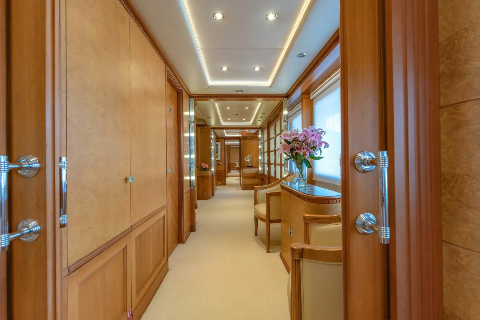 a hallway with a table and chairs aboard AZUL V Yacht for Charter