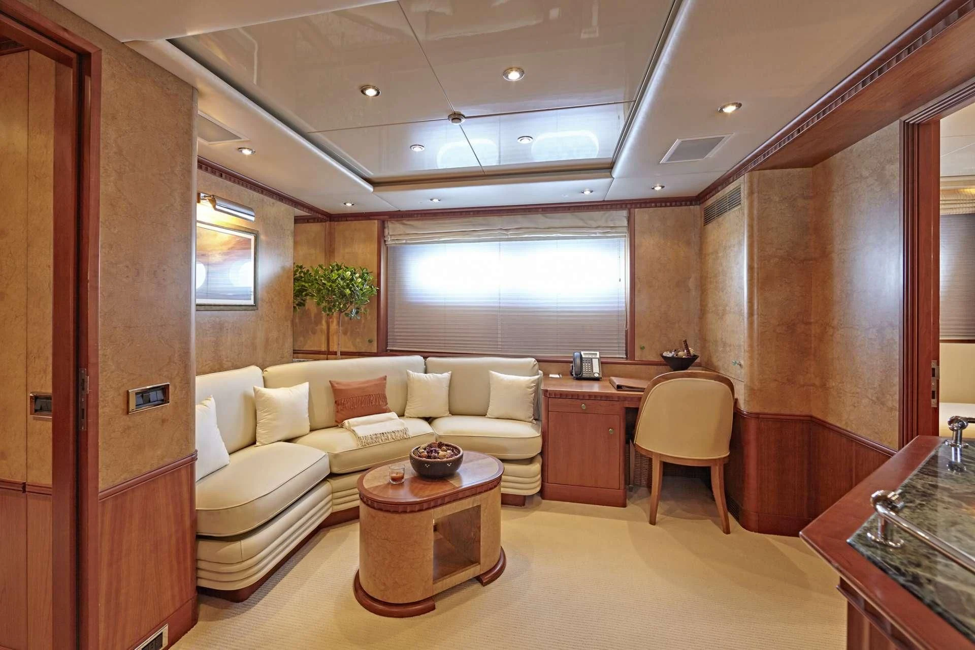 a living room with a couch and a table aboard AZUL V Yacht for Charter