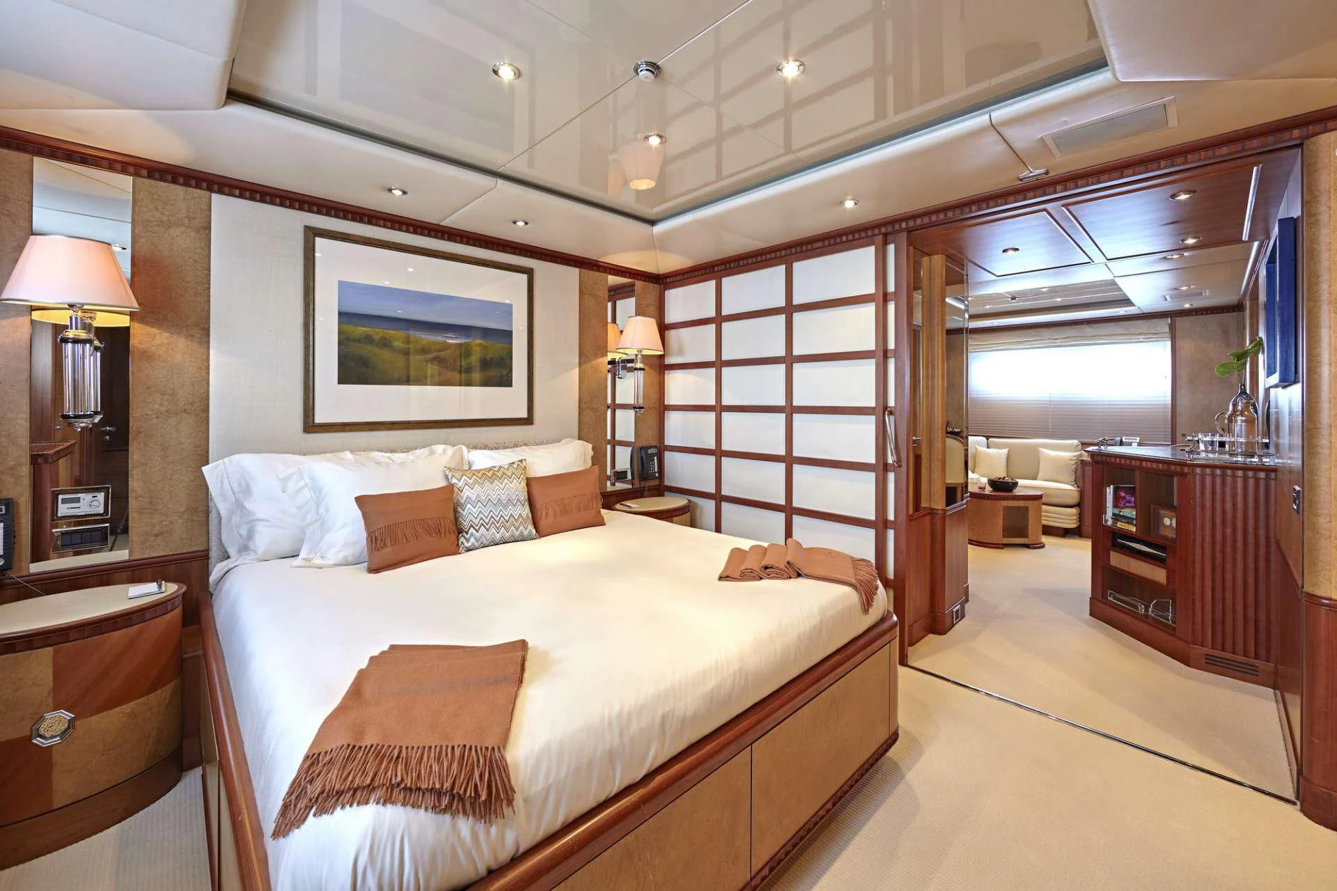 a bedroom with a bed and a desk aboard AZUL V Yacht for Charter