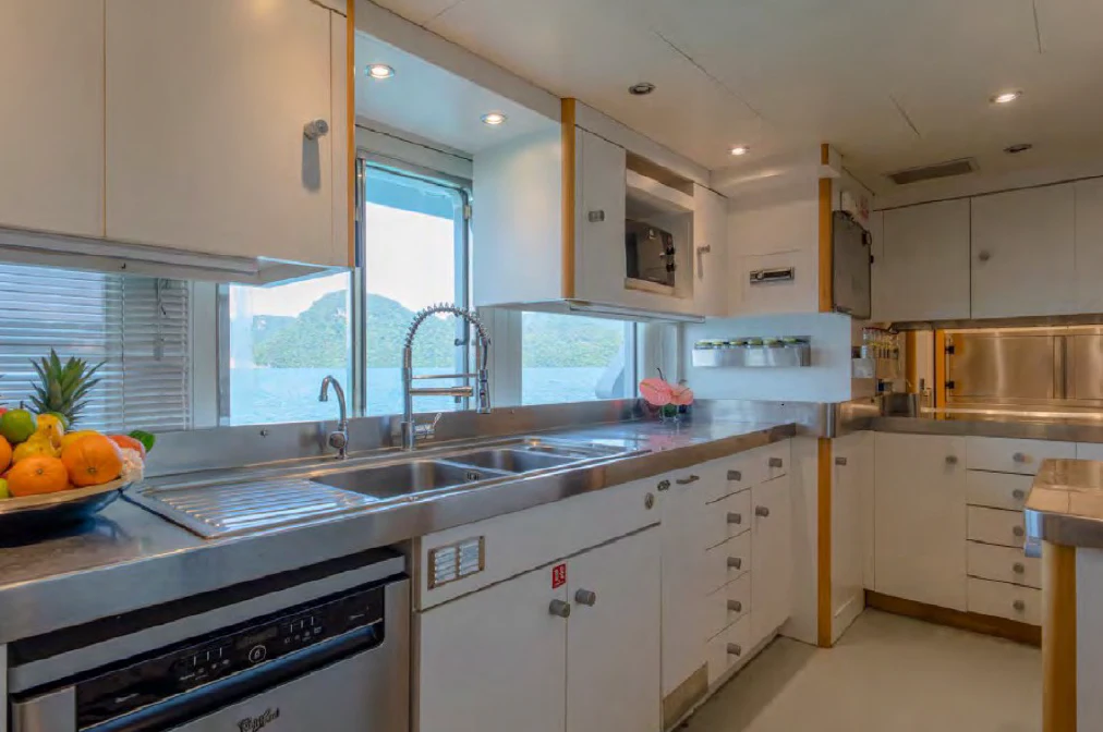 a kitchen with white cabinets aboard AZUL V Yacht for Charter