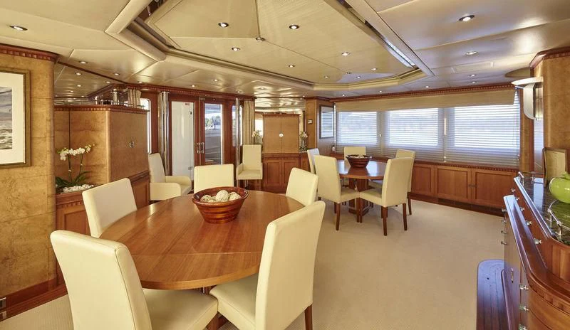 a large kitchen with a dining table aboard AZUL V Yacht for Charter