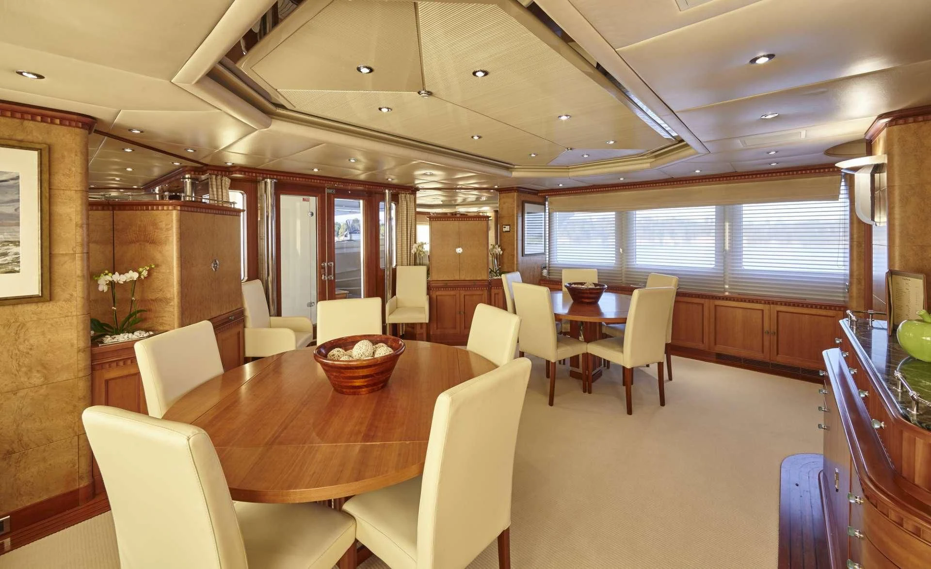 a large kitchen with a dining table aboard AZUL V Yacht for Charter