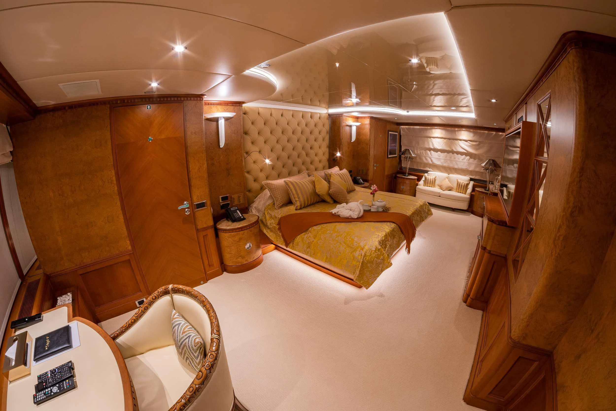 a large living room with a large mirror aboard AZUL V Yacht for Charter