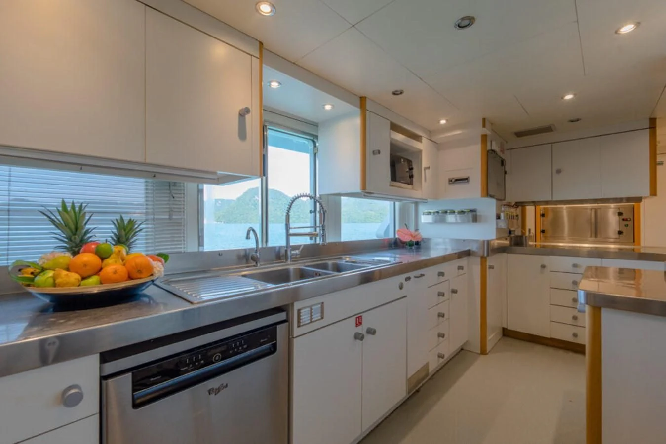 a kitchen with white cabinets aboard AZUL V Yacht for Charter