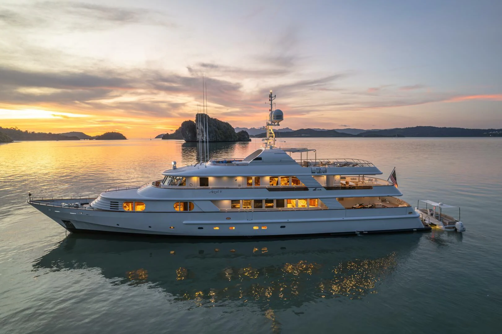 a large white boat on the water aboard AZUL V Yacht for Charter