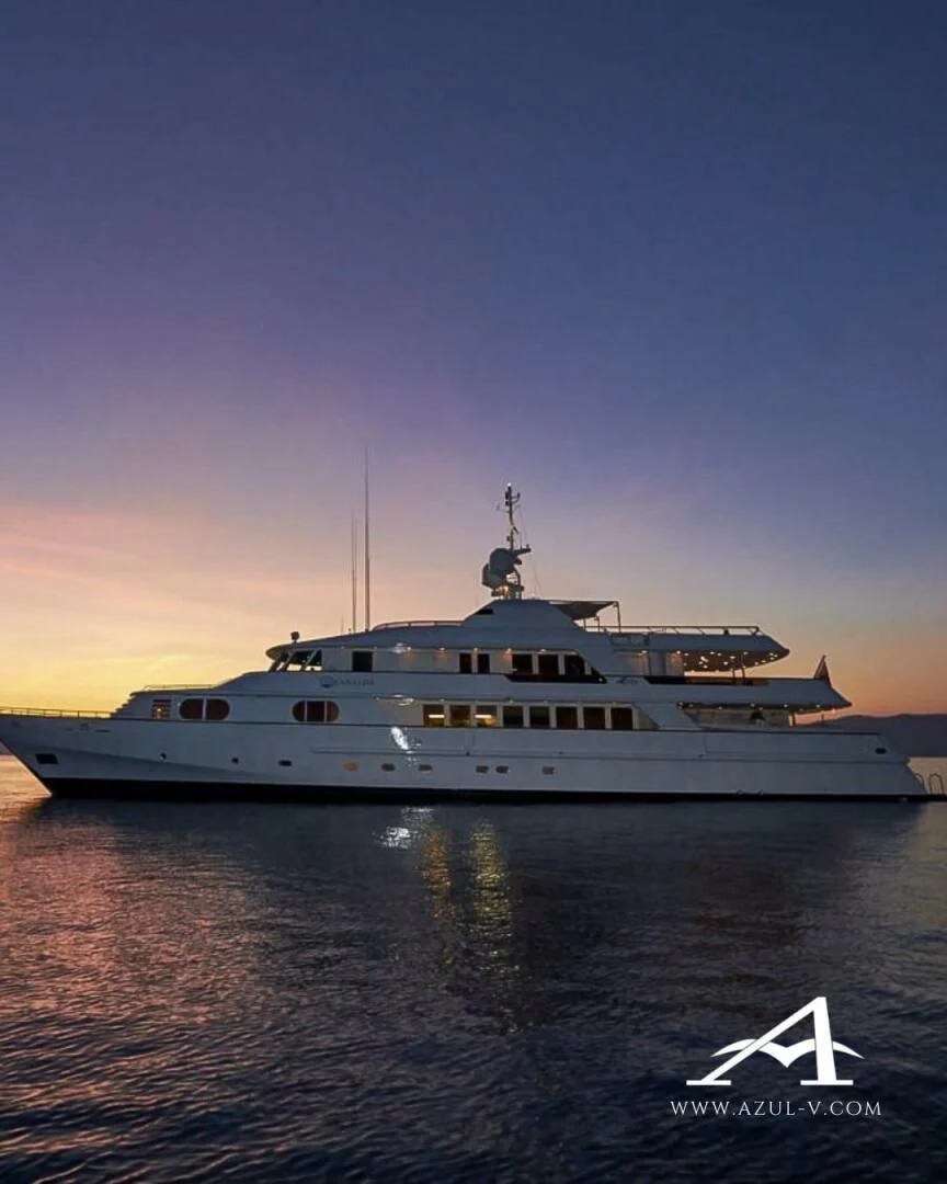 a large white boat in the water aboard AZUL V Yacht for Charter