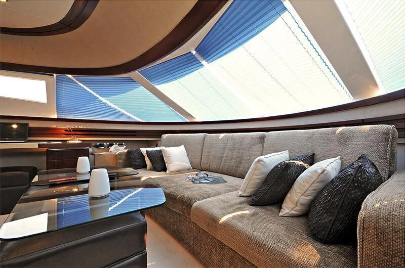 a living room with a large window aboard M.T. TIME Yacht for Sale