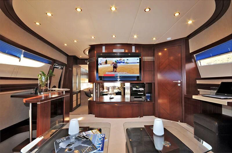 a room with a table and tv aboard M.T. TIME Yacht for Sale