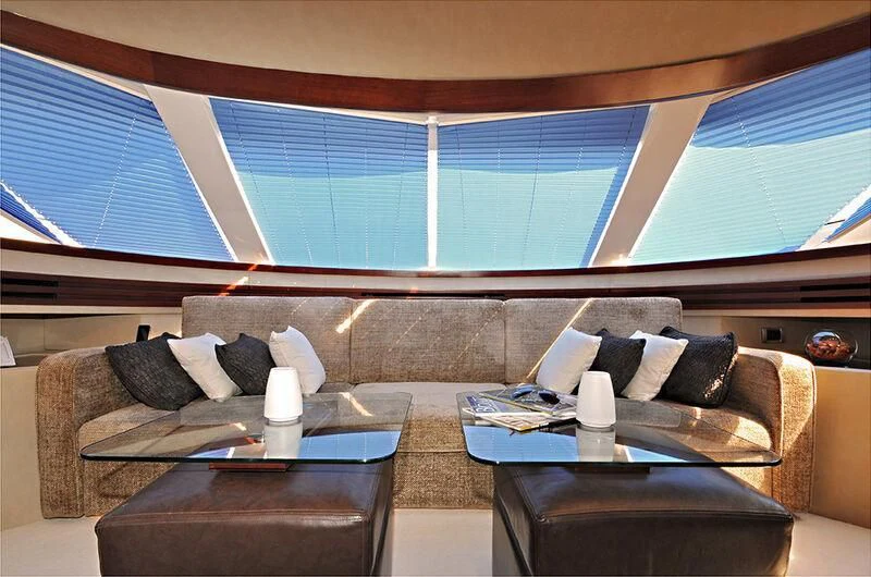 a living room with a couch and a coffee table aboard M.T. TIME Yacht for Sale