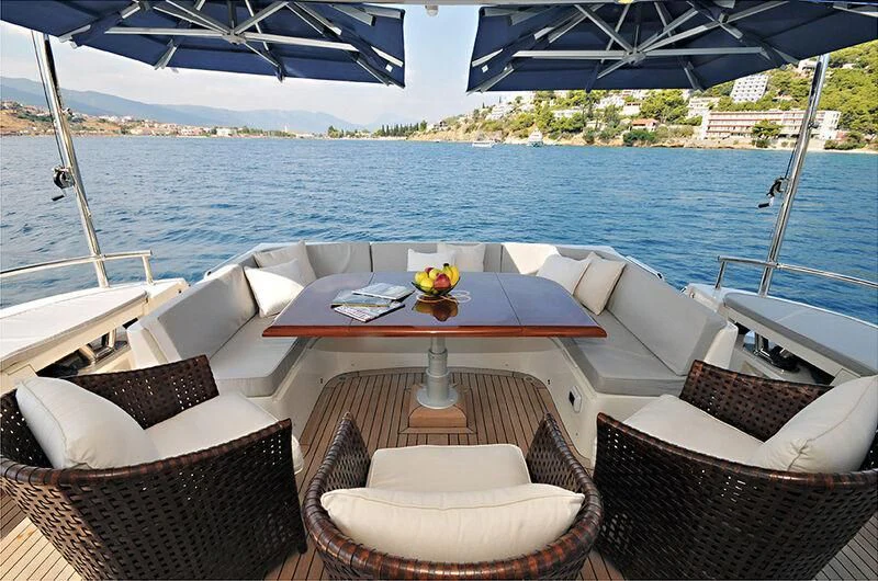 a table on a boat aboard M.T. TIME Yacht for Sale