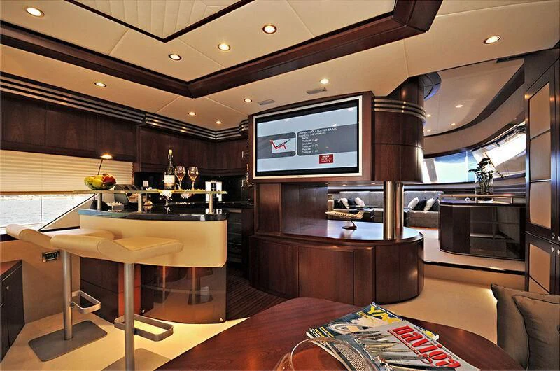 a living room with a tv aboard M.T. TIME Yacht for Sale