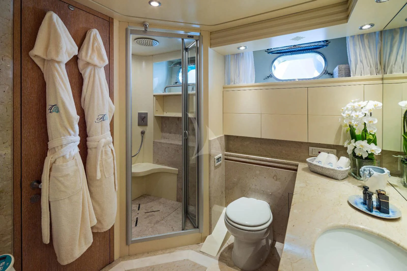 a bathroom with a glass shower aboard AMAYA Yacht for Sale