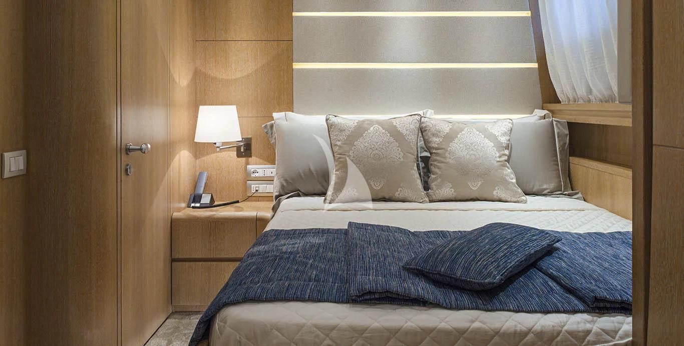 a bed with pillows aboard AMAYA Yacht for Sale