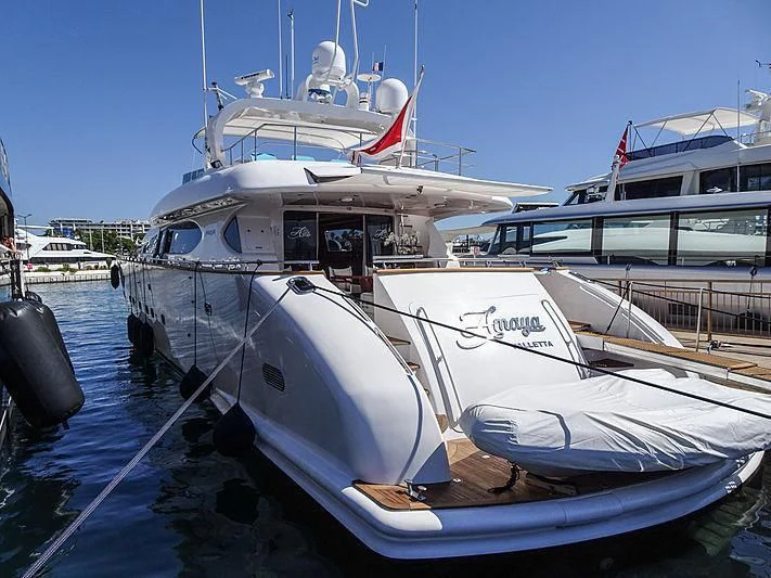 a boat docked at a pier aboard AMAYA Yacht for Sale